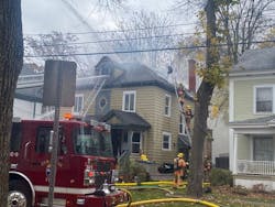 Two Syracuse firefighters were treated for burns sustained in this house fire. Two Syracuse firefighters were treated for burns sustained in this house fire.