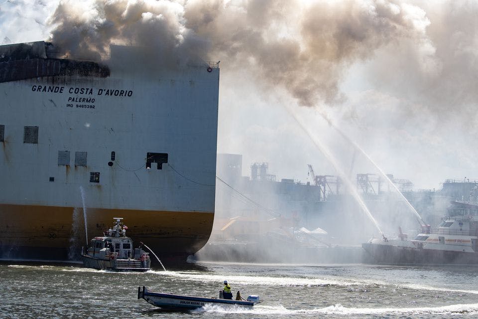 Crews continue to battle a fire on the Grande Costa D'Avorio in Port Newark a day after two Newark firefighters died in the fire.