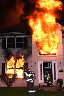 Members of the Nancy Run Fire Company and the Palmer Municipal Fire Department forced entry for an interior attack on a two-story, single-family dwelling in Bethlehem Township, PA, that had heavy fire from the back of the house coming through the roof.