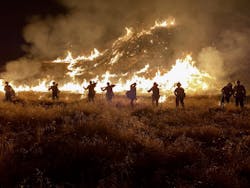 A Cal-Fire Pilot Rock hand crew battles the Rabbit Fire. The crew was burning out a piece of unburned vegetation to assist in containing the fire. A Cal-Fire Pilot Rock hand crew battles the Rabbit Fire. The crew was burning out a piece of unburned vegetation to assist in containing the fire.