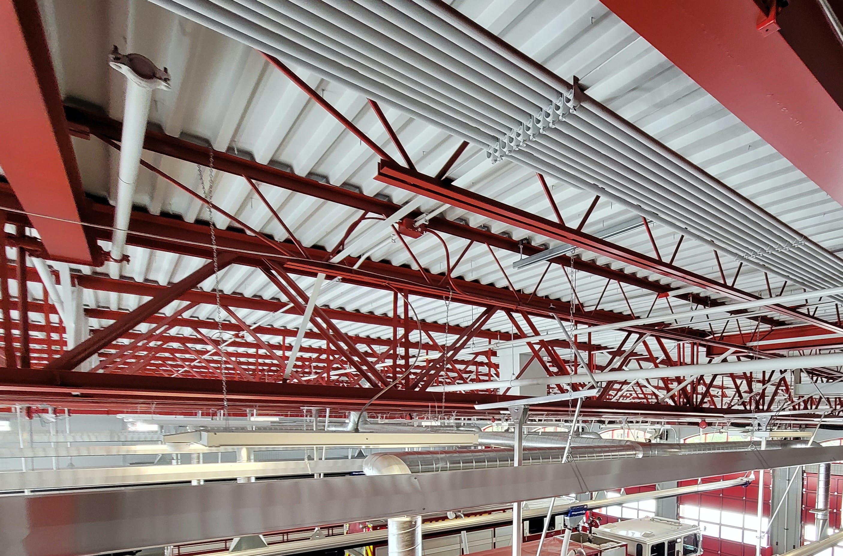 Many apparatus bays have exposed steel joists, conduit, ductwork and piping, which create countless surfaces that can collect carcinogens and are challenging to keep clean.