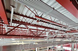 Many apparatus bays have exposed steel joists, conduit, ductwork and piping, which create countless surfaces that can collect carcinogens and are challenging to keep clean. Many apparatus bays have exposed steel joists, conduit, ductwork and piping, which create countless surfaces that can collect carcinogens and are challenging to keep clean.