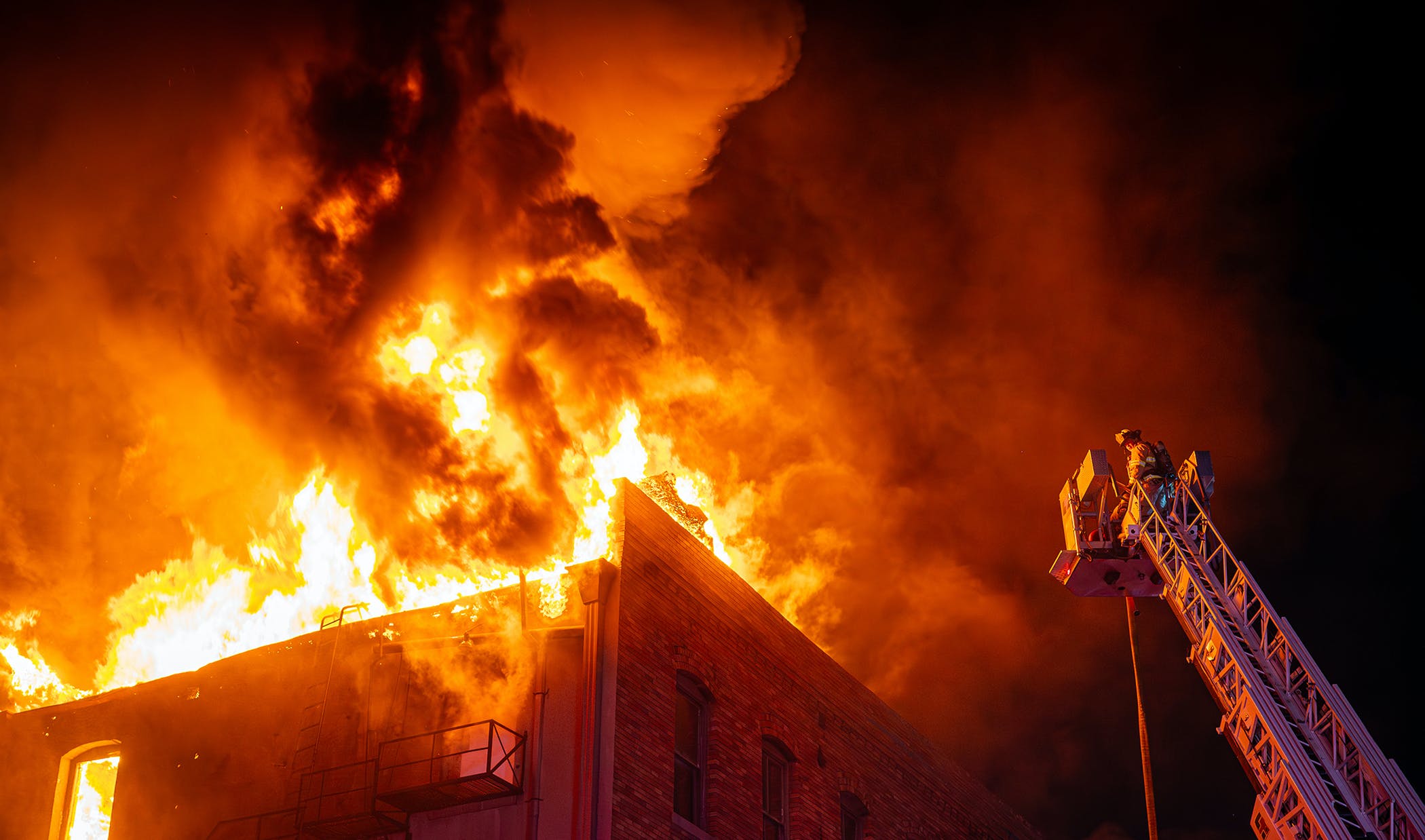 Engine 12 was returning from a call and noticed a large volume of fire engulfing the rear of a bar.