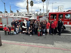 Los Angeles Battalion Chief Gene Bednarchik dresses as Santa and Apparatus Operator Mike Brehm and Brehm’s father, a retired firefighter, are honored as ancestors of Highland Park during the parade. Los Angeles Battalion Chief Gene Bednarchik dresses as Santa and Apparatus Operator Mike Brehm and Brehm’s father, a retired firefighter, are honored as ancestors of Highland Park during the parade.