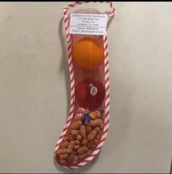 The stockings are stuffed by firefighters and citizens with peanuts, mints, gum, apples and oranges. The stockings are stuffed by firefighters and citizens with peanuts, mints, gum, apples and oranges.