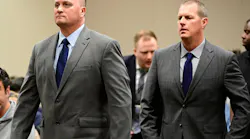 Aurora paramedics Jeremy Cooper, left, and Peter Cichuniec attend an arraignment on Jan. 20, 2023. They were found guilty of criminally negligent homicide in the death of patient Elijah McClain.