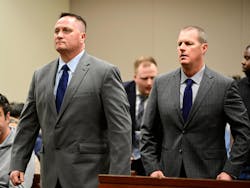 Aurora paramedics Jeremy Cooper, left, and Peter Cichuniec attend an arraignment on Jan. 20, 2023. They were found guilty of criminally negligent homicide in the death of patient Elijah McClain.