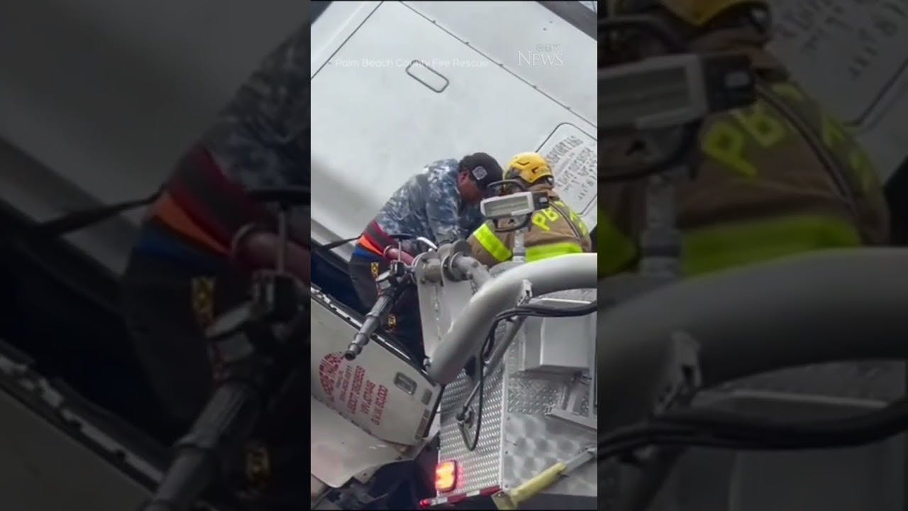 Firefighters rescue driver from truck dangling off overpass