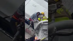 Firefighters rescue driver from truck dangling off overpass