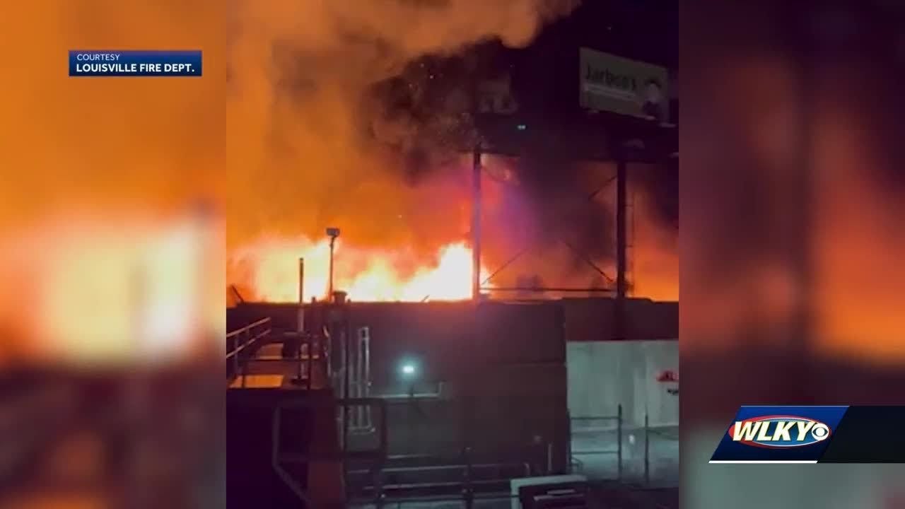 Massive fire in Portland neighborhood destroys building, scorches I-64 bridge