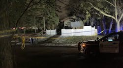 A St. Paul police squad car parked outside the home where a house fire claimed three lives and several left others injured. A St. Paul police squad car parked outside the home where a house fire claimed three lives and several left others injured.