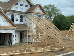 A lightweight roof assembly is being installed on a modern estate home that’s under construction. A lightweight roof assembly is being installed on a modern estate home that’s under construction.
