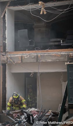Fort Worth firefighters exit the Sandman Hotel after searching the building. Fort Worth firefighters exit the Sandman Hotel after searching the building.