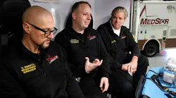 MedStar EMS crew from left, Chris Roberts, Brandon Pate and John Hamilton discuss their duties at the hotel explosion.