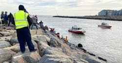 EMS crews, firefighters and civilians formed a human chain to rescue the man. EMS crews, firefighters and civilians formed a human chain to rescue the man.
