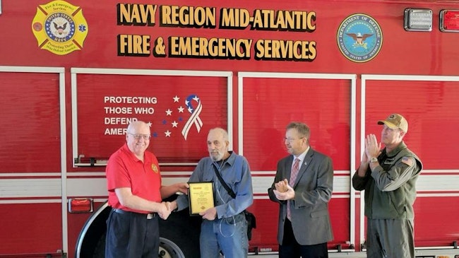 Carl Glover, Director of Navy Fire & Emergency Services (left) presented the 2023 EVT of the Year Award to David Rupert. Joining are retired Navy Region Mid-Atlantic Fire Chief Kevin Janney, and Capt. John Montagnet, Director Operating Forces at Navy Region Mid-Atlantic.