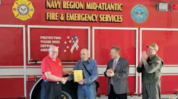 Carl Glover, Director of Navy Fire & Emergency Services (left) presented the 2023 EVT of the Year Award to David Rupert. Joining are retired Navy Region Mid-Atlantic Fire Chief Kevin Janney, and Capt. John Montagnet, Director Operating Forces at Navy Region Mid-Atlantic.