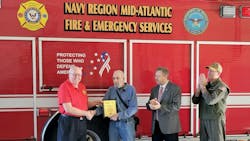 Carl Glover, Director of Navy Fire & Emergency Services (left) presented the 2023 EVT of the Year Award to David Rupert. Joining are retired Navy Region Mid-Atlantic Fire Chief Kevin Janney, and Capt. John Montagnet, Director Operating Forces at Navy Region Mid-Atlantic. Carl Glover, Director of Navy Fire & Emergency Services (left) presented the 2023 EVT of the Year Award to David Rupert. Joining are retired Navy Region Mid-Atlantic Fire Chief Kevin Janney, and Capt. John Montagnet, Director Operating Forces at Navy Region Mid-Atlantic.