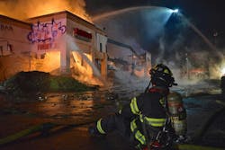 Multiple calls to 9-1-1 reported heavy smoke coming from a vacant commercial building. Multiple calls to 9-1-1 reported heavy smoke coming from a vacant commercial building.