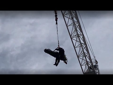 DC firefighters rescue injured worker from rooftop