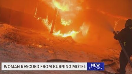 Firefighters save woman trapped in burning motel