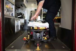 A medic straightens the cot. A medic straightens the cot.