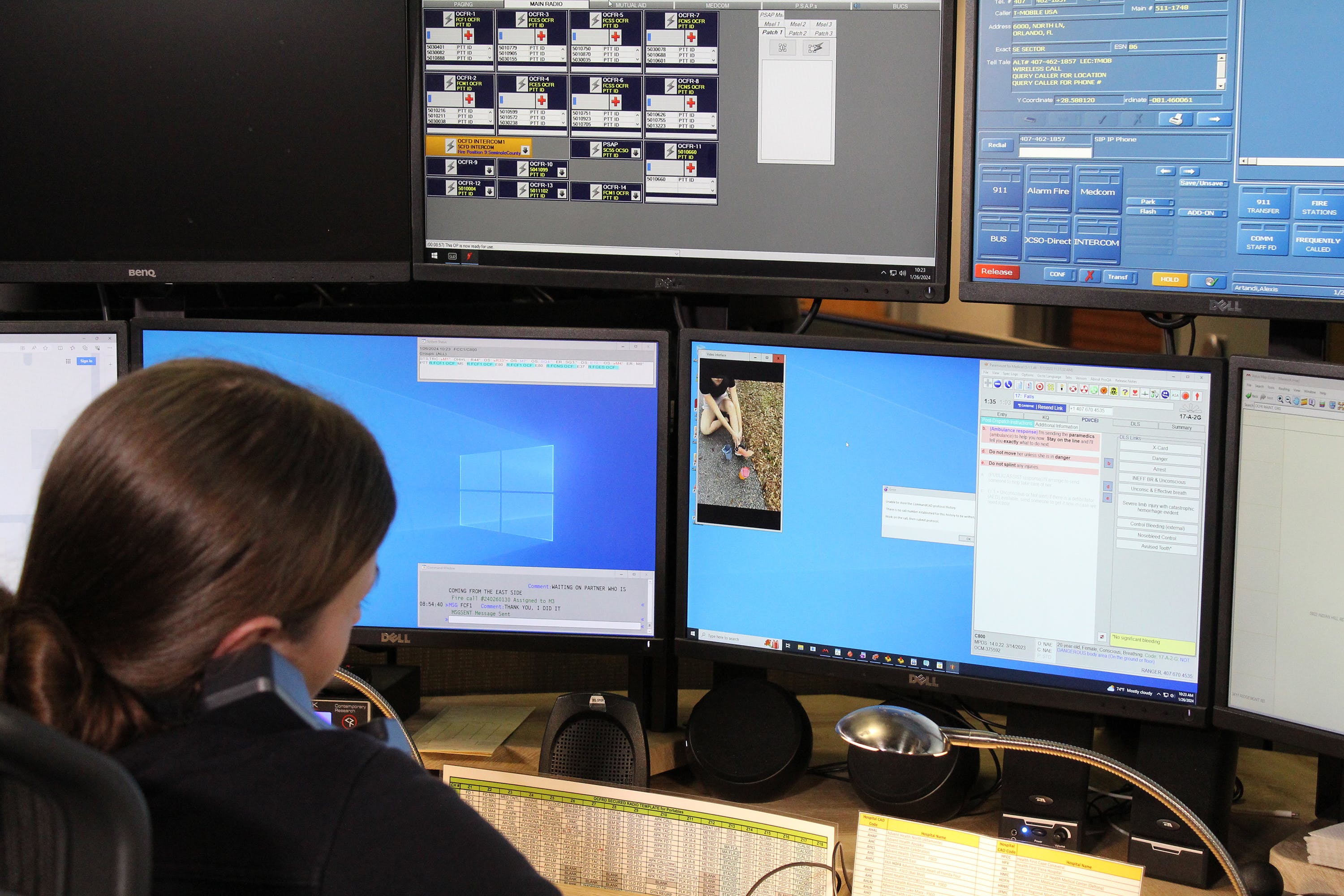 An Orange County, Florida, emergency dispatcher demonstrates new 911 video calling technology in a mock scenario. (