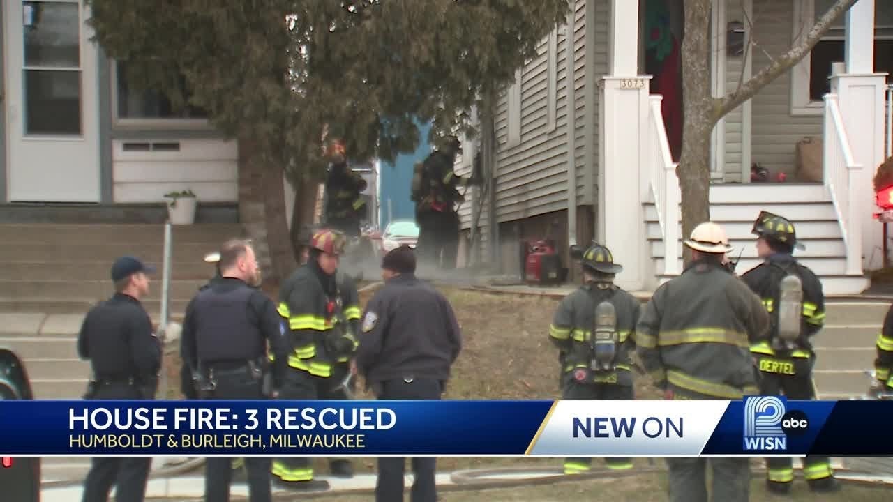 Milwaukee fire crews rescue three people trapped in house fire