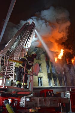 Firefighters who were on scene first saw heavy black smoke and heavy fire involvement on multiple floors at a vacant, four-story, residential structure.