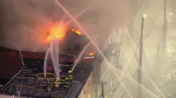 100 firefighters battle massive building fire in North Philly