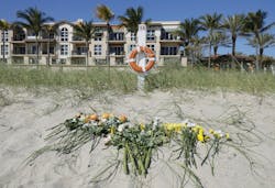 Flowers were placed along the beach to honor a girl died when she was buried in a sand hole.