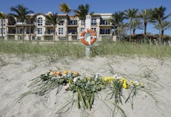 Flowers were placed along the beach to honor a girl died when she was buried in a sand hole. Flowers were placed along the beach to honor a girl died when she was buried in a sand hole.
