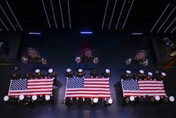 Honor guards fold the flags at the memorial service for the Burnsville firefighter and officers. Honor guards fold the flags at the memorial service for the Burnsville firefighter and officers.