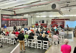 A new pumper destined for Pasco County, FL, Fire Rescue served as a backdrop for the celebration Wednesday. On the wall to the left is a 50-year timeline covering E-ONE's history. A new pumper destined for Pasco County, FL, Fire Rescue served as a backdrop for the celebration Wednesday. On the wall to the left is a 50-year timeline covering E-ONE's history.