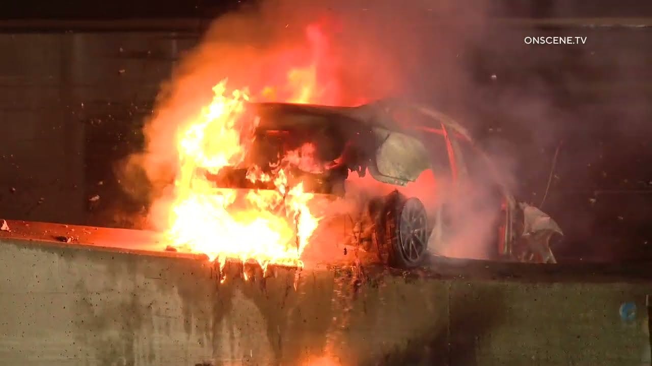 Los Angeles Firefighters Battle Tesla Fire after Car Falls from Bridge