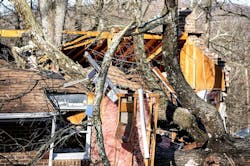 A man was killed while two people escaped after a tree fell on the house.