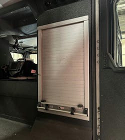 A standard size EMS compartment is mounted on the rear seat riser. The roll-up door is lockable.