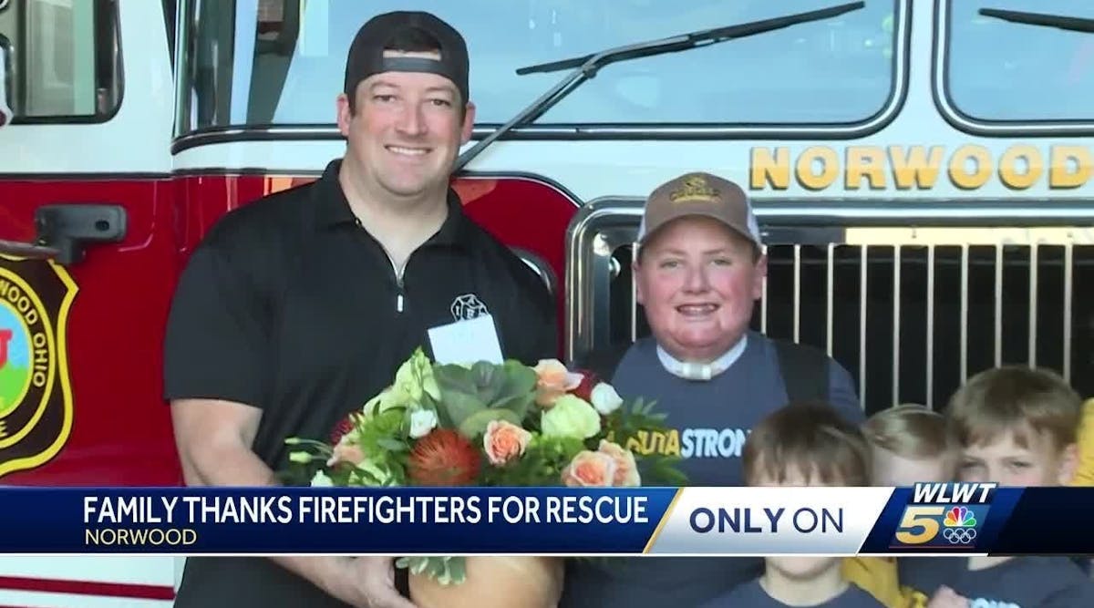 Family delivers flowers to Norwood Fire Department as appreciation for rescue