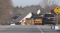 WATCH: Tractor-trailer hangs over bridge, driver and family injured WATCH: Tractor-trailer hangs over bridge, driver and family injured