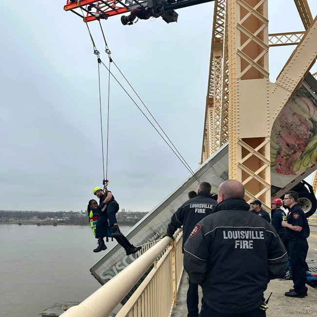 Louisville Firefighter Rappels from Bridge