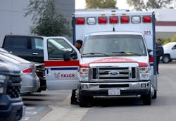 A Falck ambulance is checked out by EMS personnel.