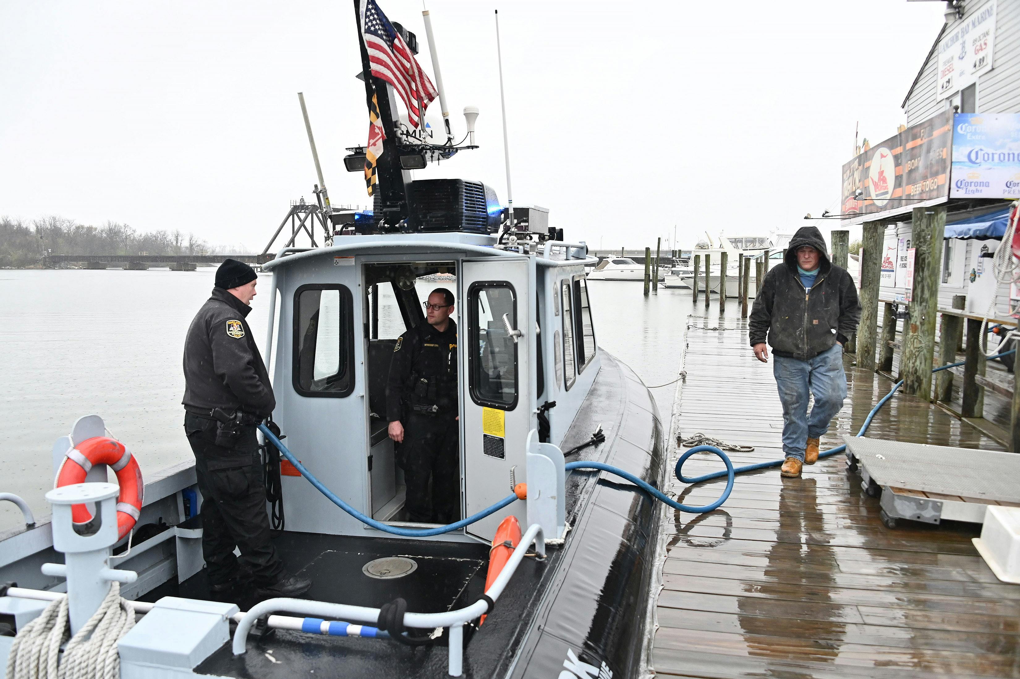 Members of the Maryland Transportation Authority Police fuel their boat at Anchor Bay East Marina in Dundalk on March 27, 2024.