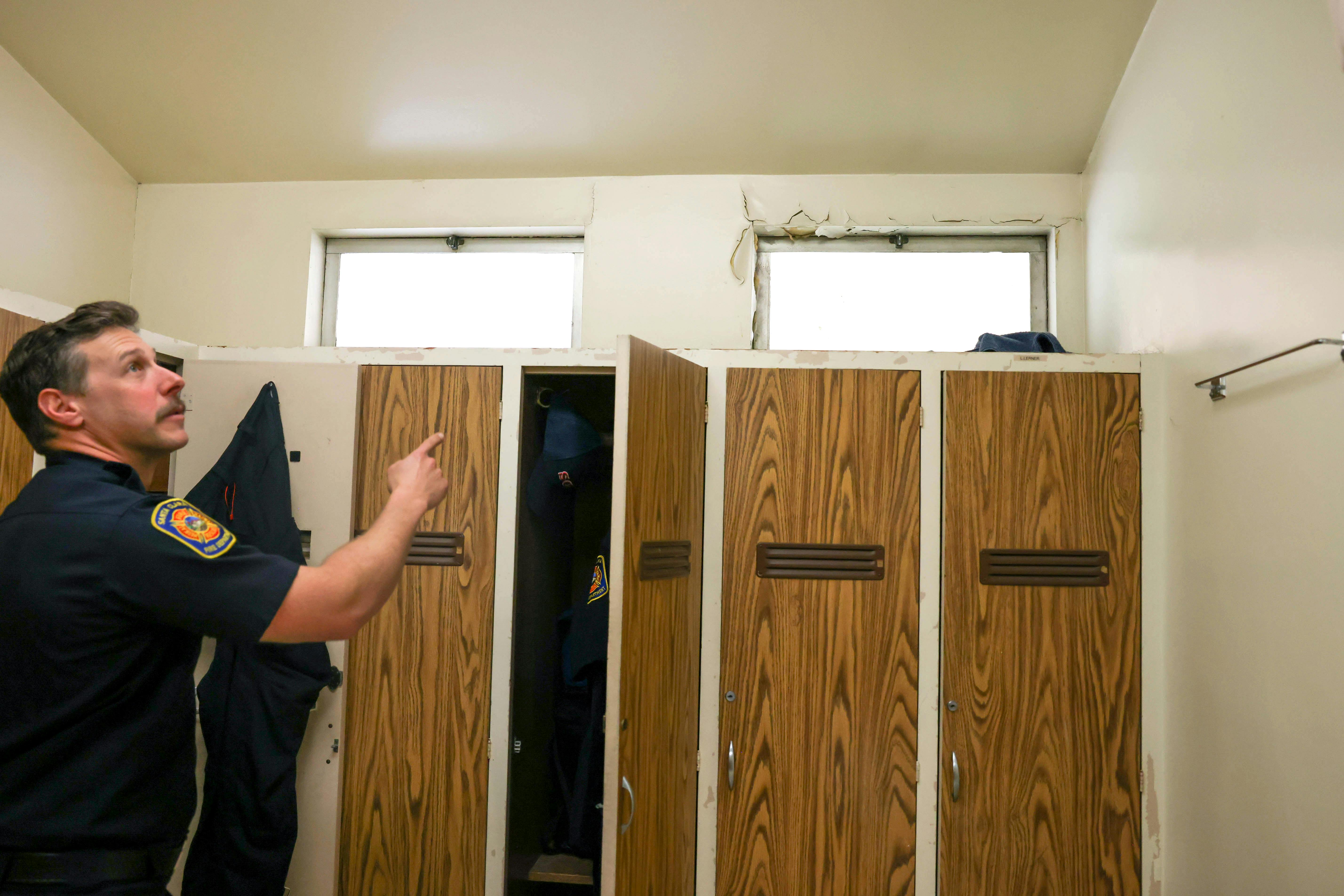 Santa Clara Firefighter/Engineer Brandon Hale points out deteriorated windows and cracked walls at Fire Station 5. Officials said the station is outdated and needs a complete teardown.