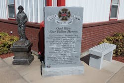 Three memorials, including a bench and a firefighter statue, are located outside the West Volunteer Fire Department&apos;s station.