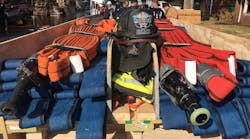 Two Wichita Bundles are secured with straps and contrasting tape to mark the halfway points in a hosebed training prop. Two Wichita Bundles are secured with straps and contrasting tape to mark the halfway points in a hosebed training prop.