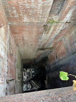 The view from the top of the roof looking down into void shaft shows that the bottom was 120 feet down. The view from the top of the roof looking down into void shaft shows that the bottom was 120 feet down.