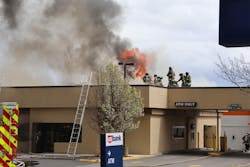 Ladder 1 arrived and cut a ventilation hole in the roof to aid interior firefighters in accessing the fire from below. Ladder 1 arrived and cut a ventilation hole in the roof to aid interior firefighters in accessing the fire from below.