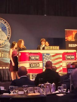 Chief Mary Cameli (right) honors Karla Klas, the recipient of the 2024 CFSI/IFSTA Dr. Anne W. Phillips Award for Leadership in Fire Safety Education.