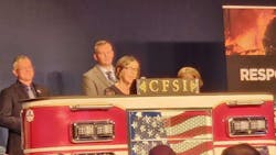 Dr. Denise Smith, the newly appointed director of the National Fire Research and Data Center, accepts the Senator Paul S. Sarbanes Fire Service Safety Leadership Award on behalf of the Skidmore College First Responder Health and Safety Laboratory. Dr. Denise Smith, the newly appointed director of the National Fire Research and Data Center, accepts the Senator Paul S. Sarbanes Fire Service Safety Leadership Award on behalf of the Skidmore College First Responder Health and Safety Laboratory.