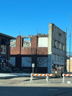 Post-fire view of the Bravo/Alpha side of the Veterans of Foreign Wars (VFW) building in Winfield, KS. The inward collapse of the upper portion of the brick veneer wall resulted in the collapse of the front portion of the second floor.